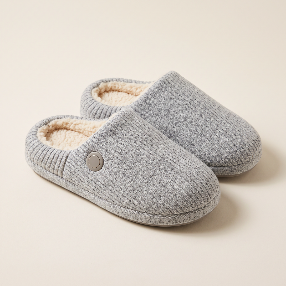 Cozy Glow heated slippers in grey, ribbed knit with sherpa lining